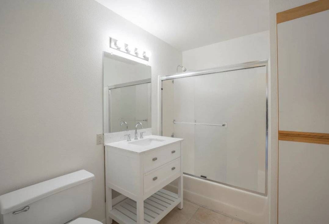 Photo of a bathroom with a shower/bathtub combination