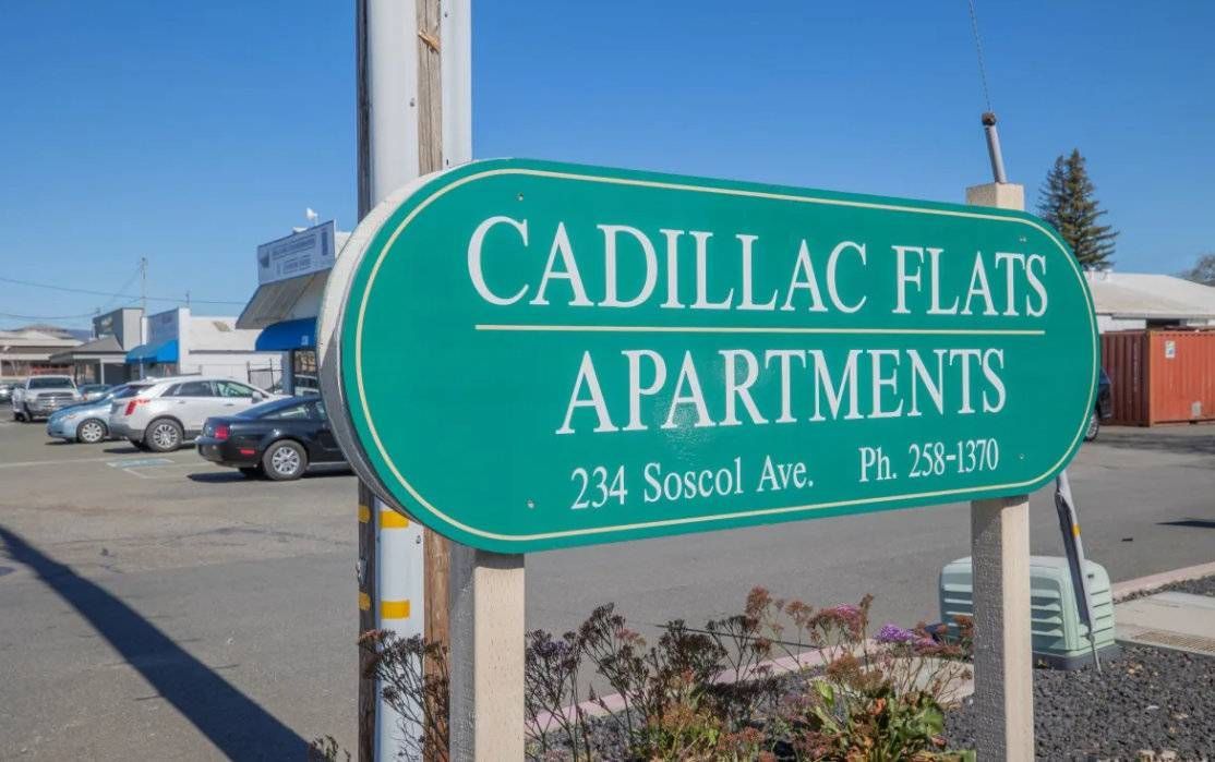Photo of a sign that says the name of the apartment community