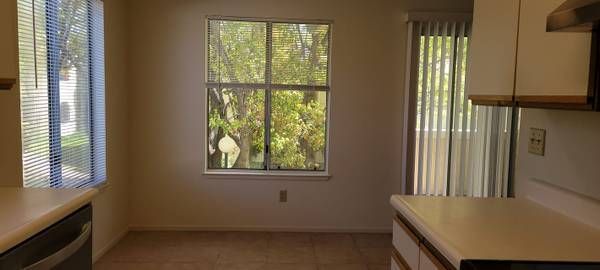 Photo of the dining area showing plenty of natural lighting from a few windows