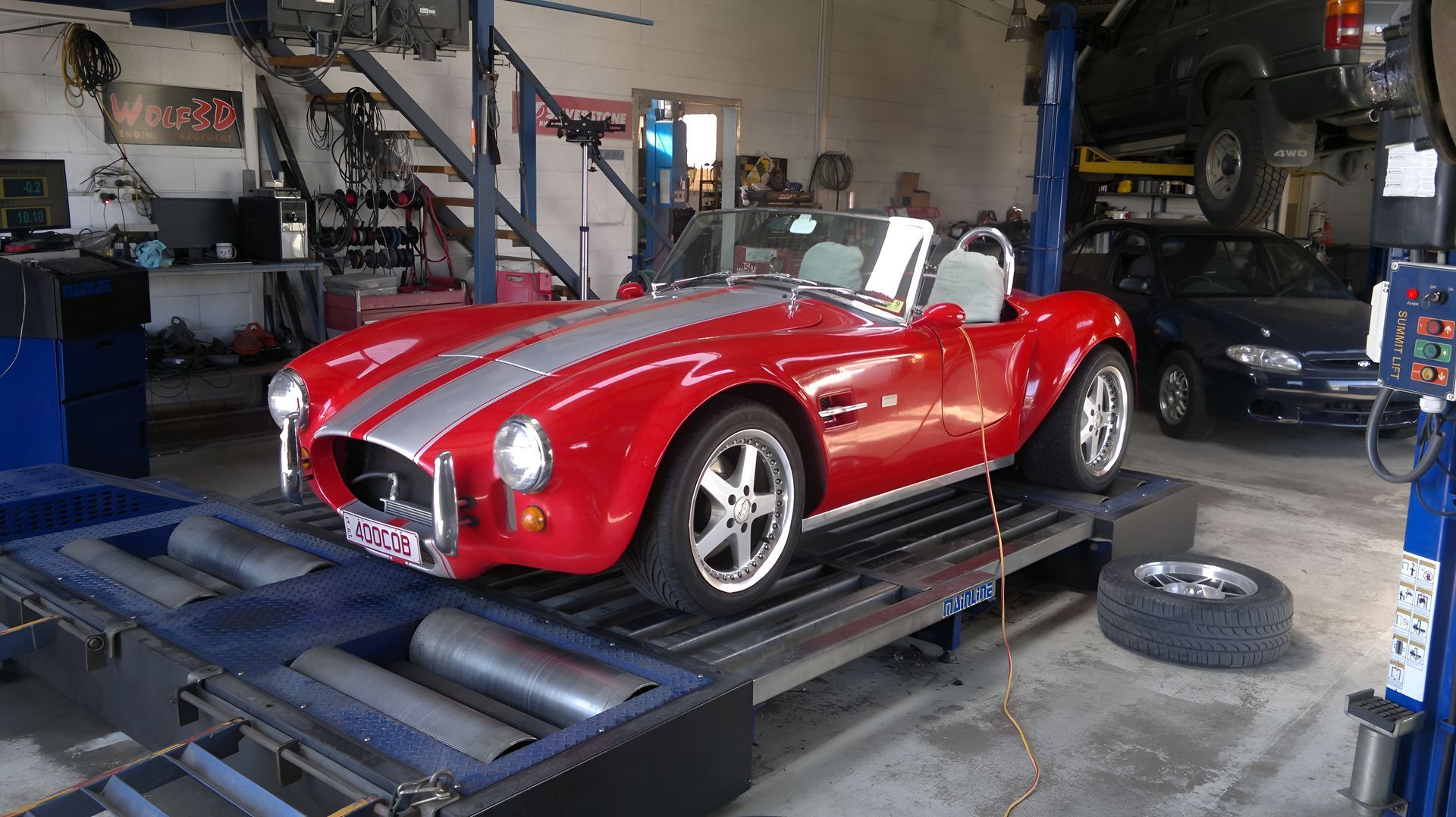 Red Shelby Cobra Sports Car on a Dyno — EFI Evolutions Mechanical Repairs in Coffs Harbour, NSW