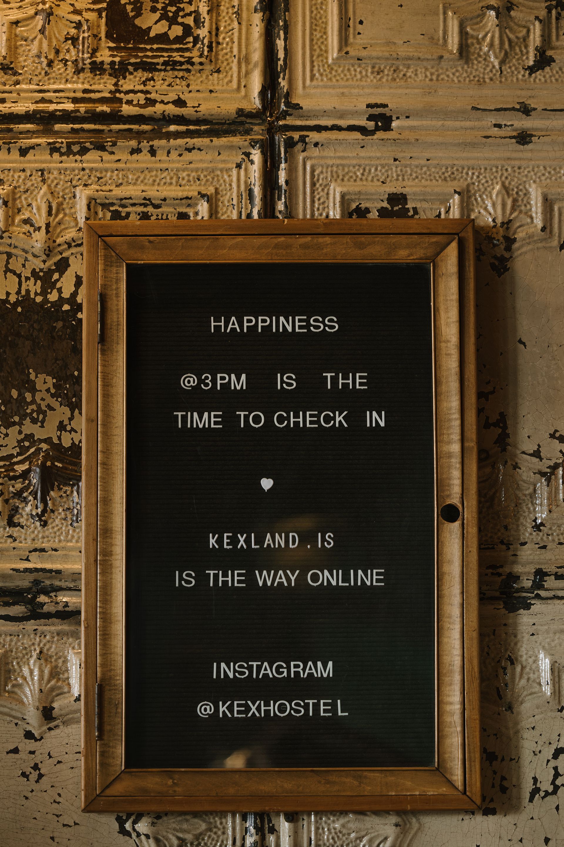 Black sign with white letters. Message: 