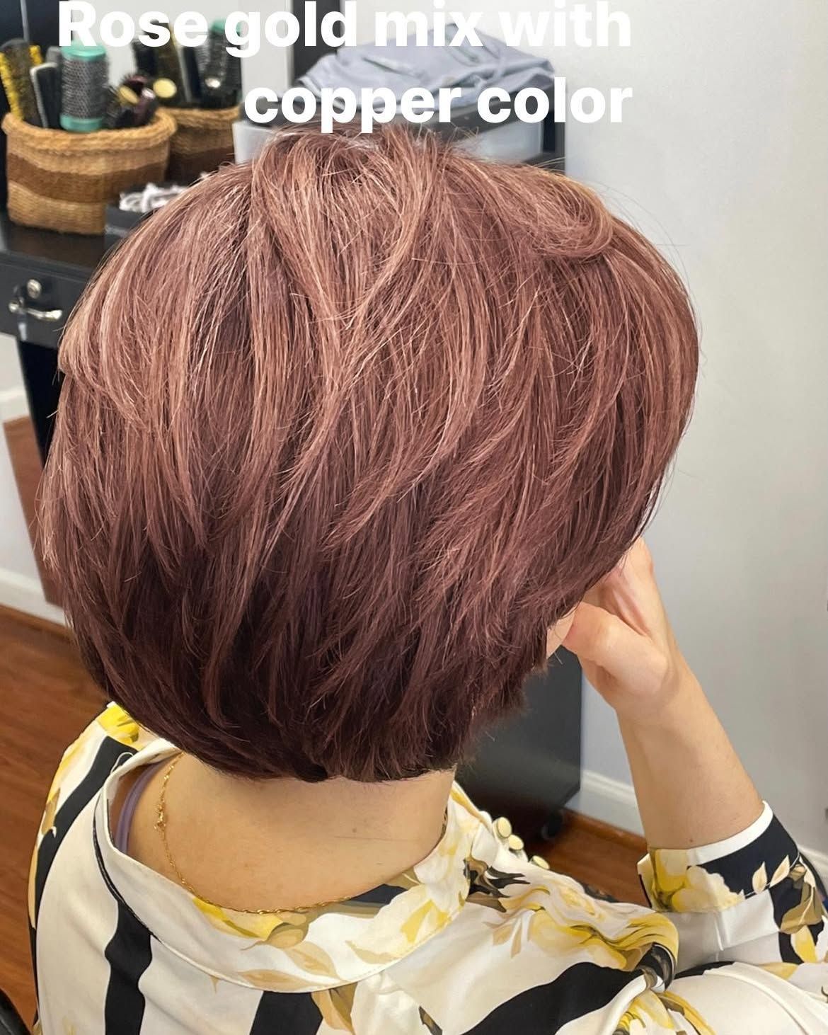 Rose gold and copper-colored short bob hairstyle.