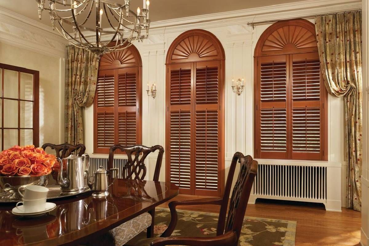 Brown Newstyle® Composite shutters installed in an elegant dining room near near Huntington, WV