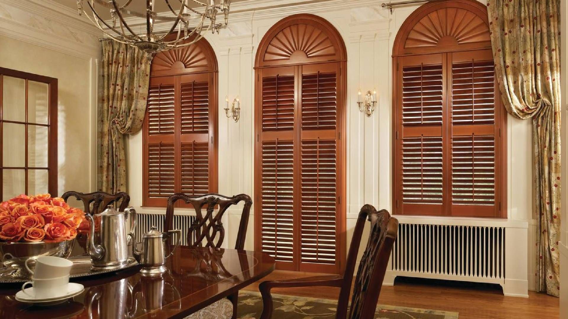 Brown Newstyle® Composite shutters installed in an elegant dining room near near Huntington, WV