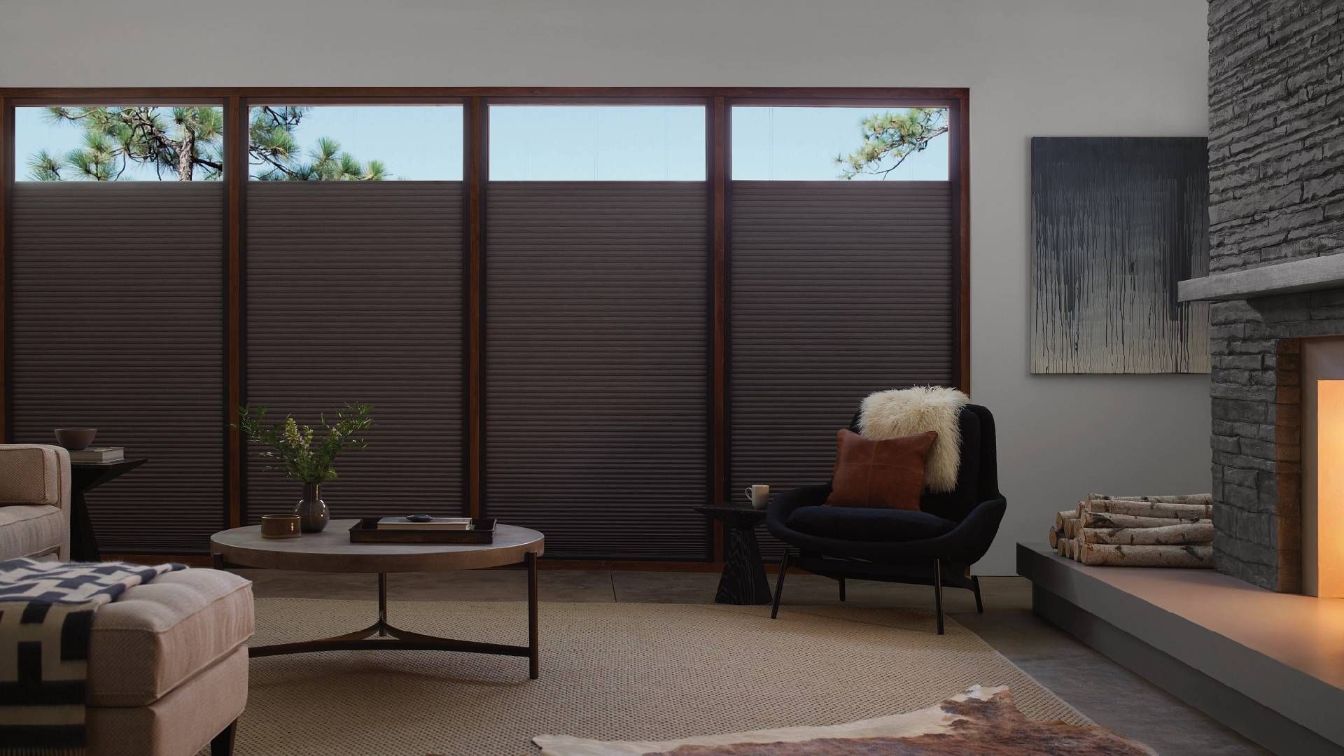 Living room with large windows decorated with Hunter Douglas Duette® Cellular Shades near Huntington