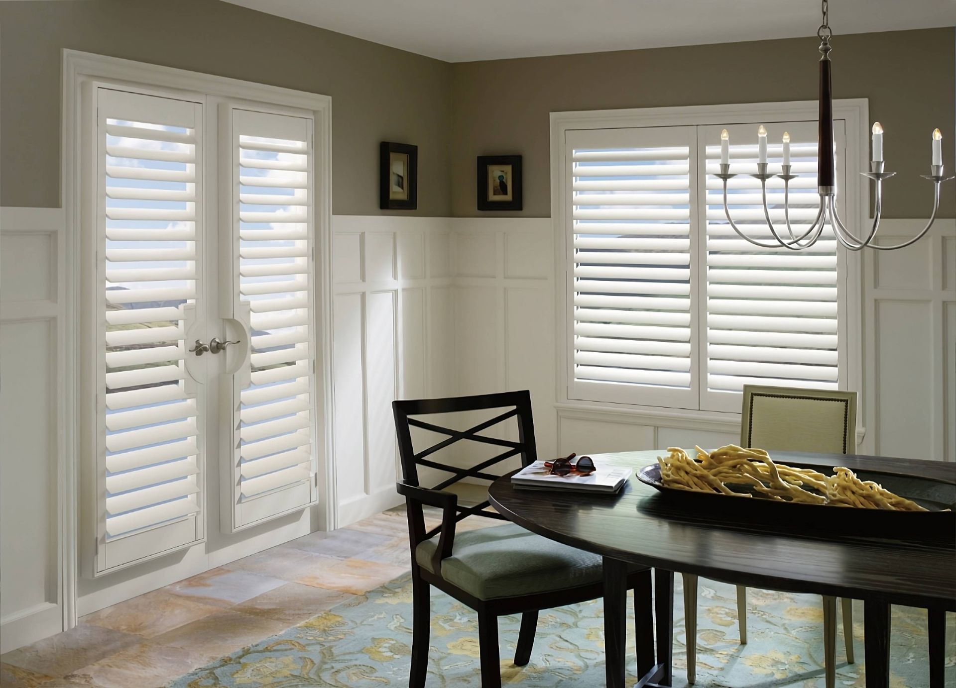 Freshly cleaned Hunter Douglas Palm Beach™ Polysatin™ Vinyl Shutters on dining room French doors and windows at Curtain Concepts near Huntington, WV