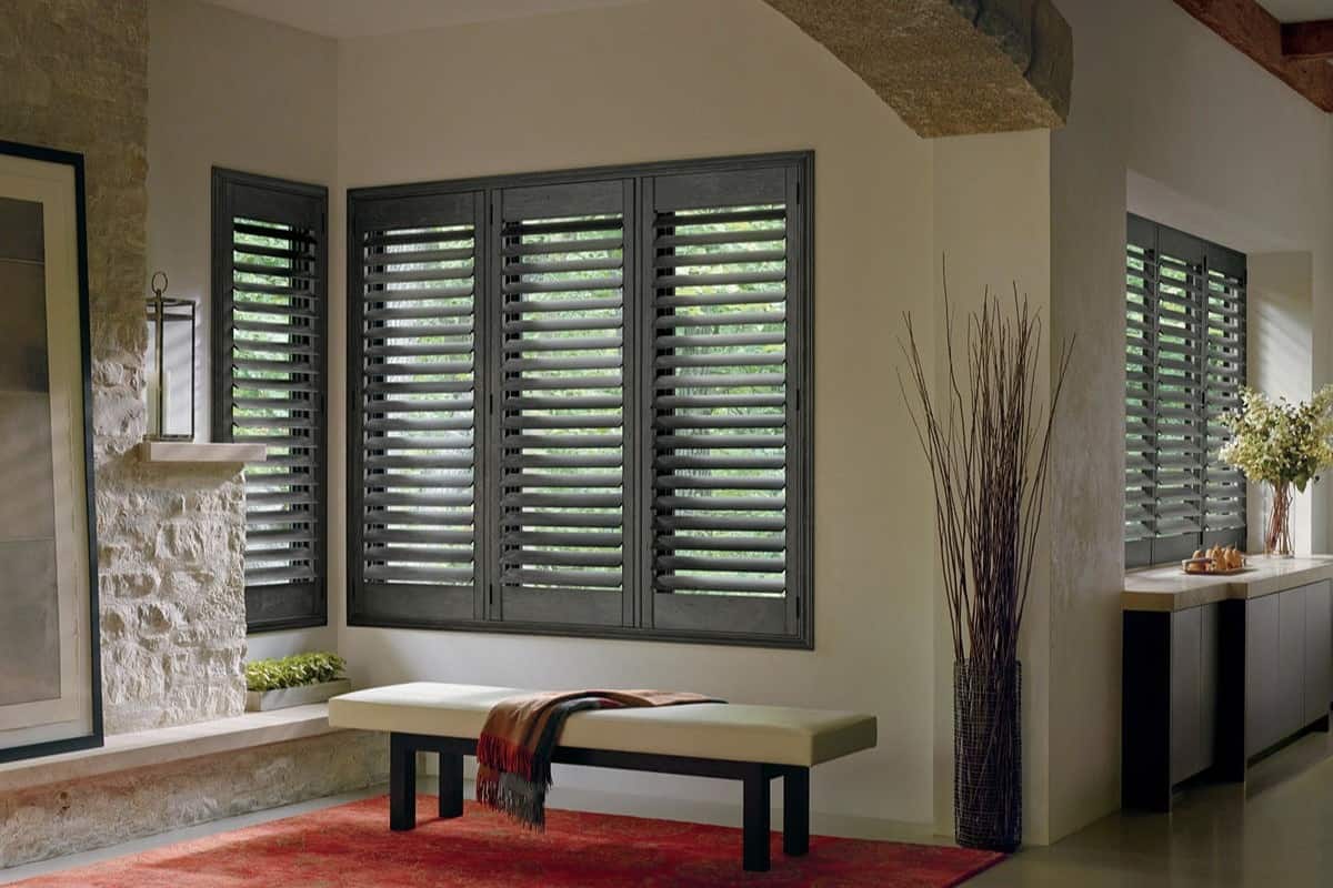 Hunter Douglas Heritance® Wood Shutters in a cozy home with all the louvers open.