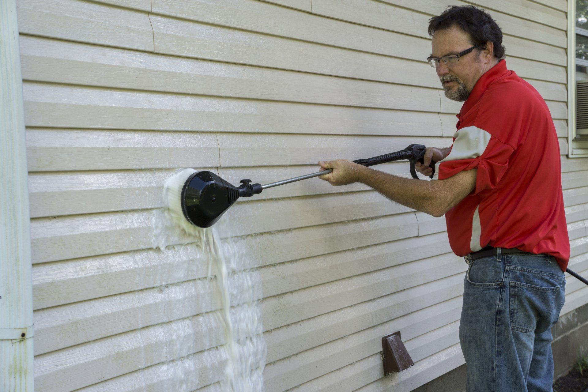 Man Using High-Pressure Brush to Remove Algae and Mold — Garfield, GA — Southeast Soft Wash Solutions