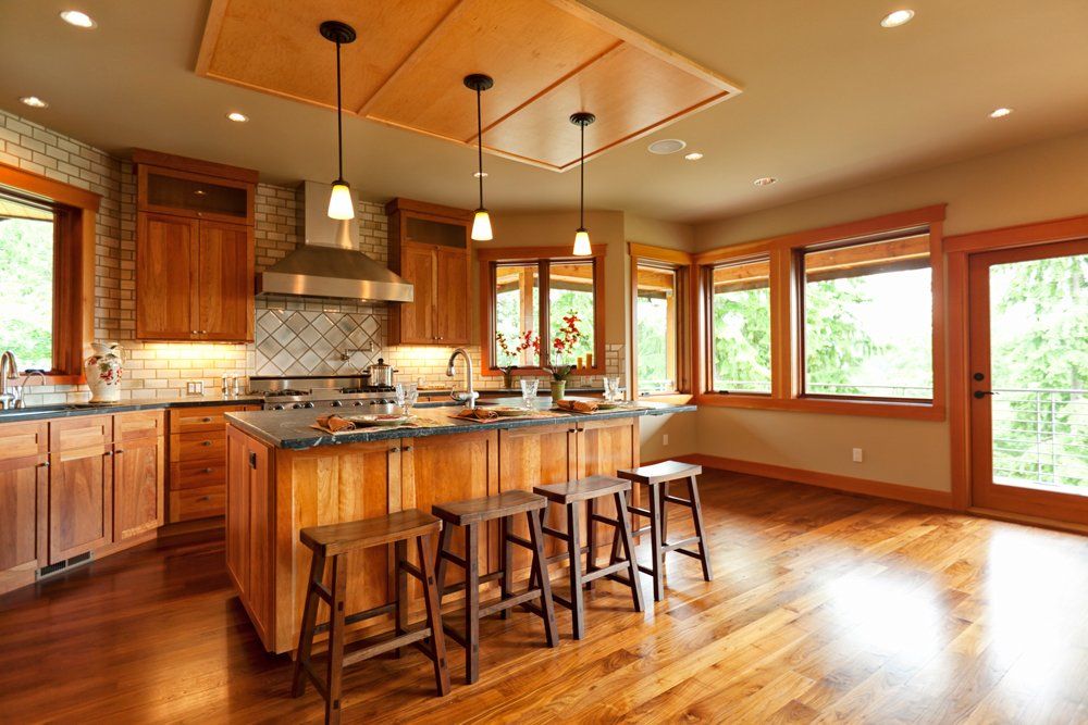 Kitchen With Wooden Cabinets And Wooden Floor - Tucson, Arizona - D & D Flooring