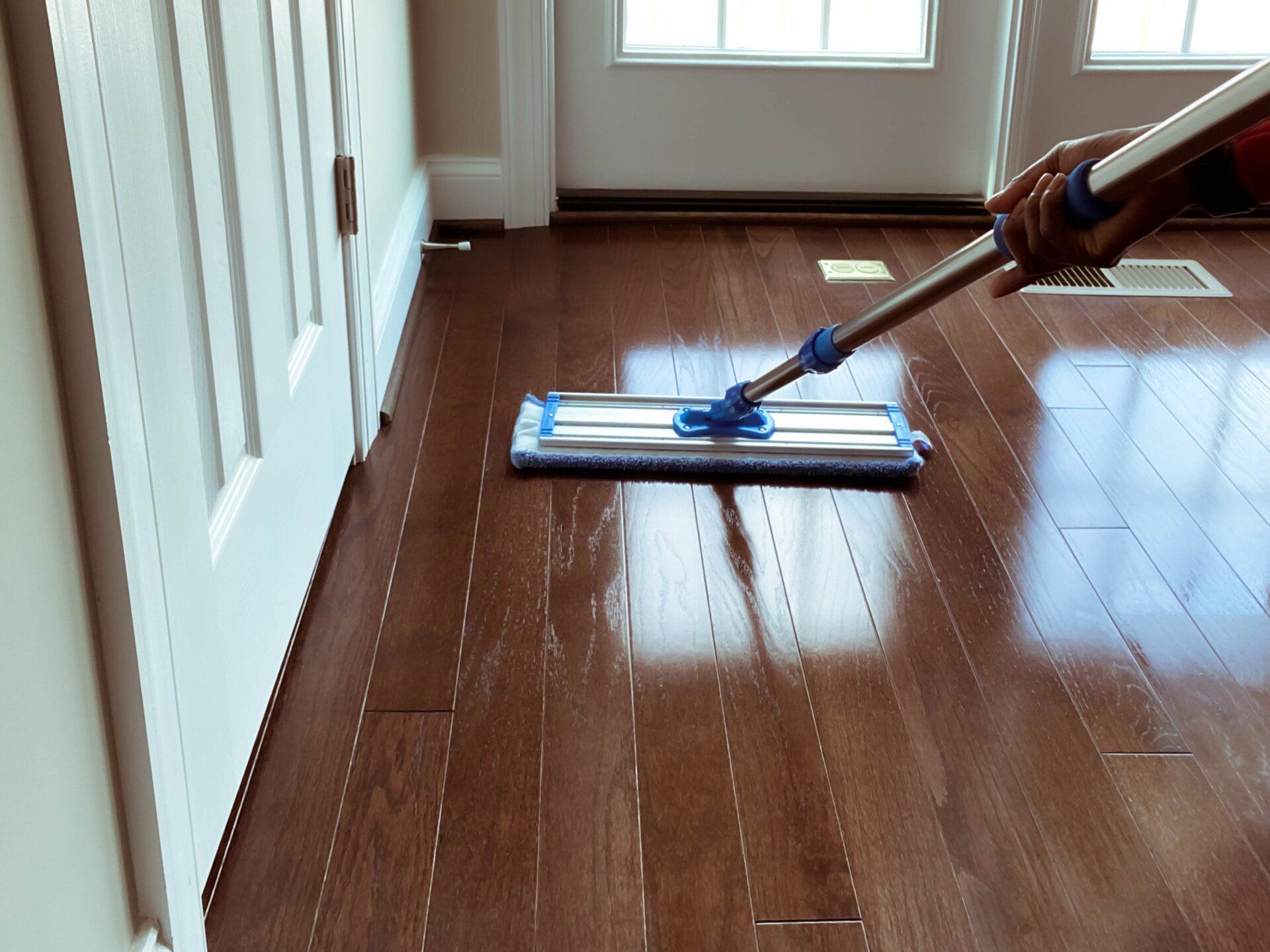 Mopping On A Wooden Floor - Tucson, Arizona - D & D Flooring