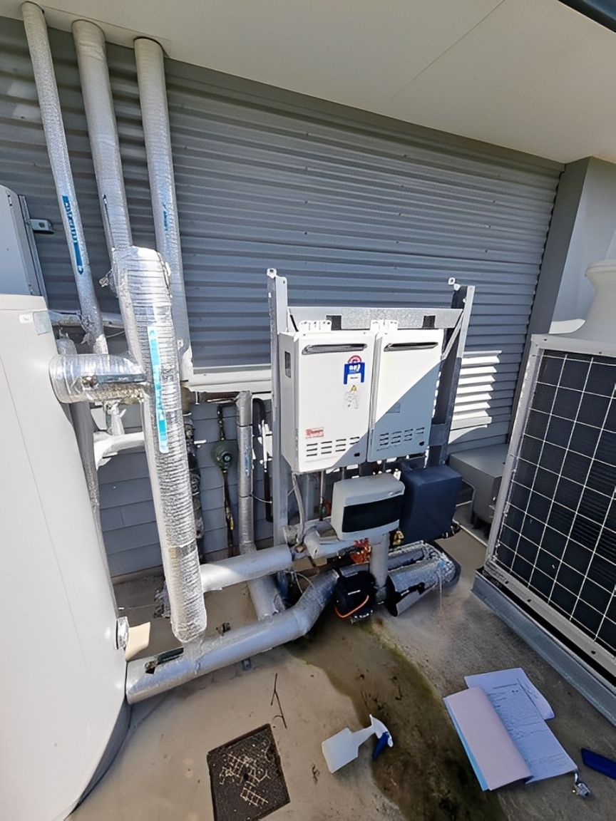 Outdoor Water Heater Unit With Pipes — Northern Plumbing In Kelso, QLD