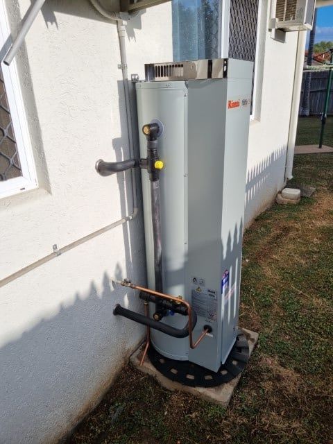 A Tall Gray Water Heater Installed on a Concrete Pad — Northern Plumbing In Burdell, QLD