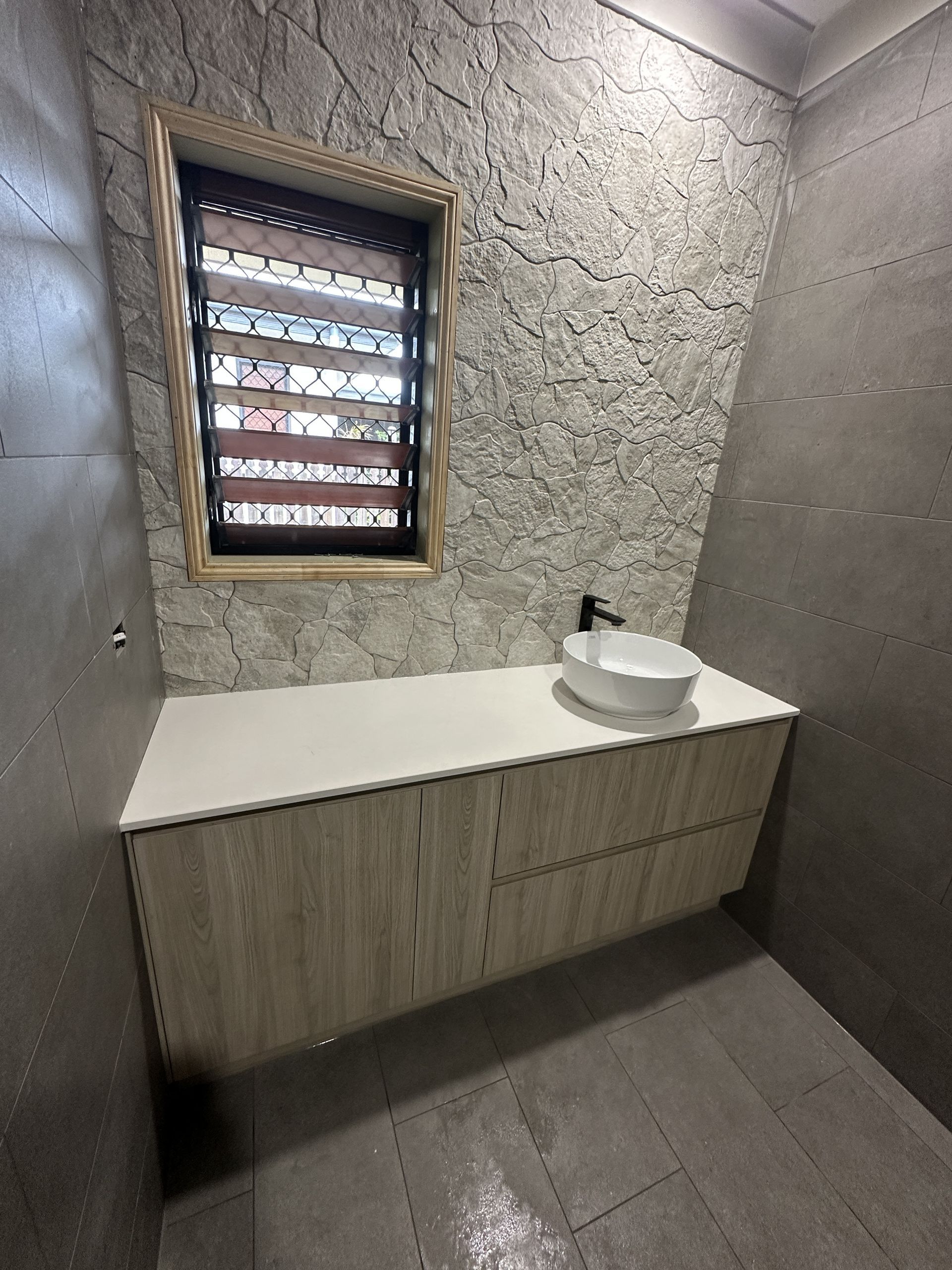 A Plumber Is Fixing A Sink With A Wrench — Northern Plumbing In Mount Louisa, QLD