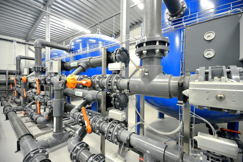 Industrial Water Treatment System With Blue Tanks — Northern Plumbing In Mundingburra, QLD