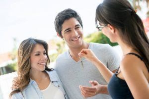 Couple being handed house keys