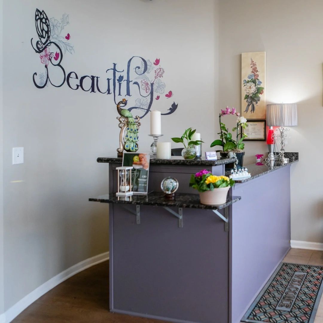 A purple counter in front of a wall that says beauty