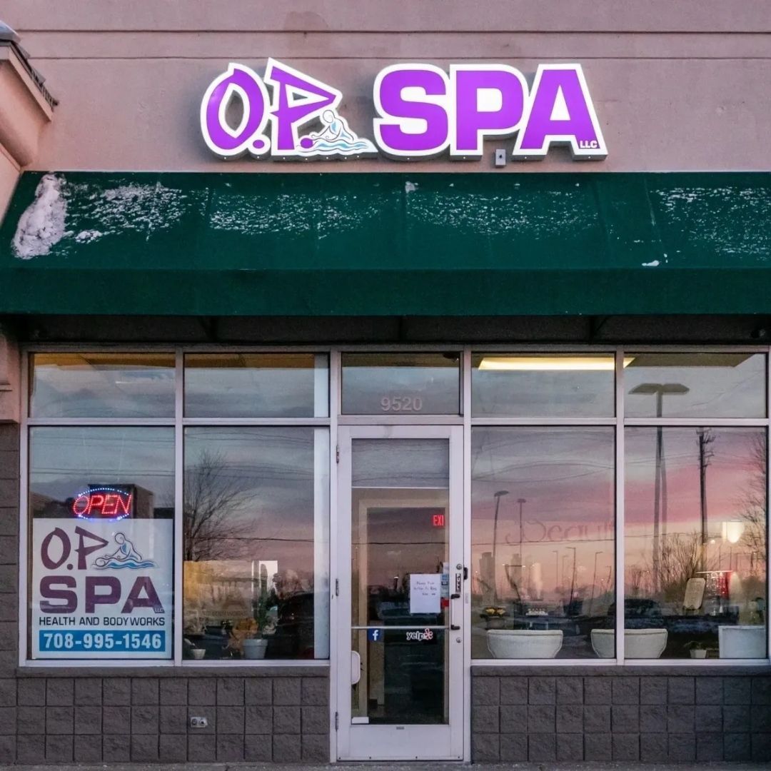 The front of a spa with a green awning