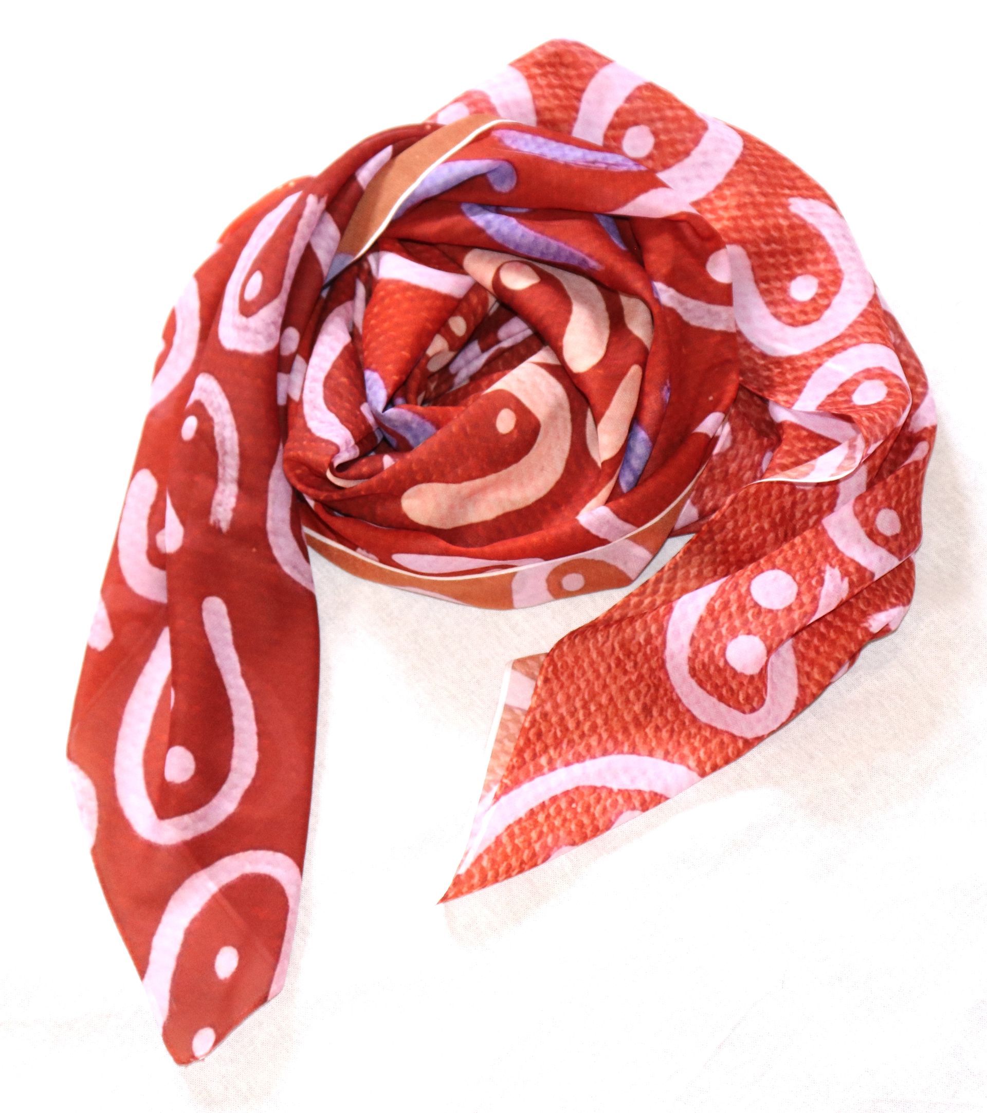 A red scarf with white circles on it