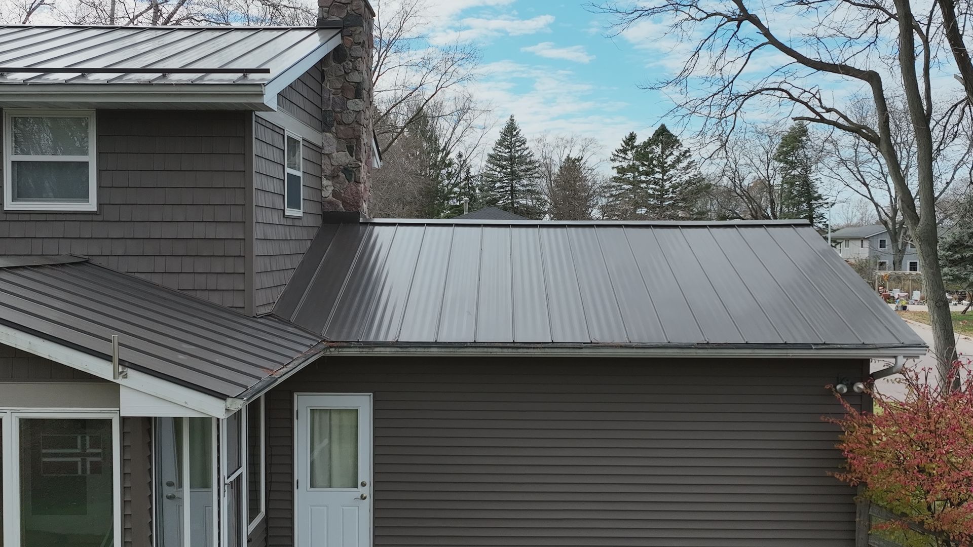 Side profile of new metal roofing and chimney flashing in Middleton WI.