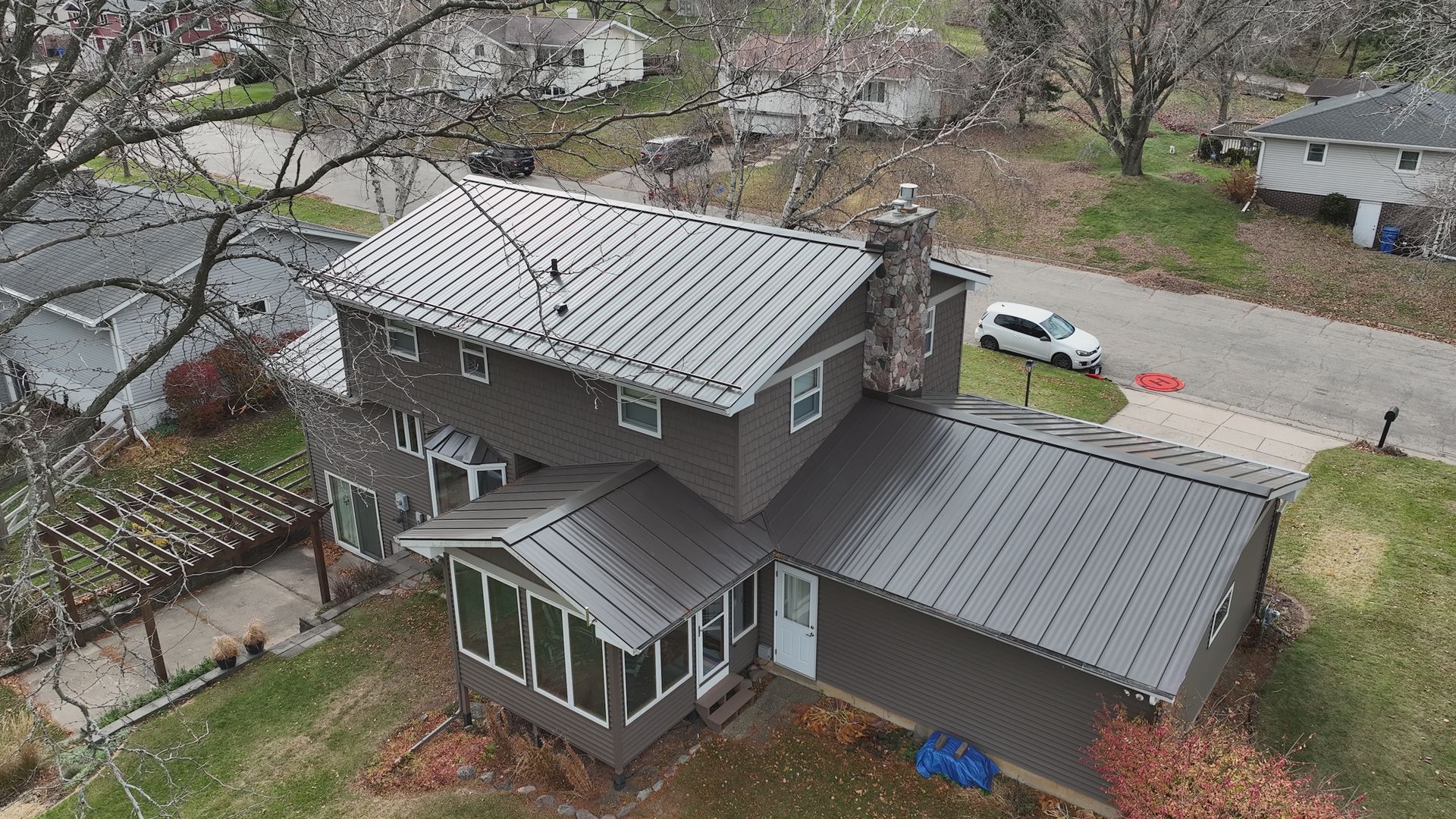 Aerial view of a complete metal roofing project on a home in Middleton WI.
