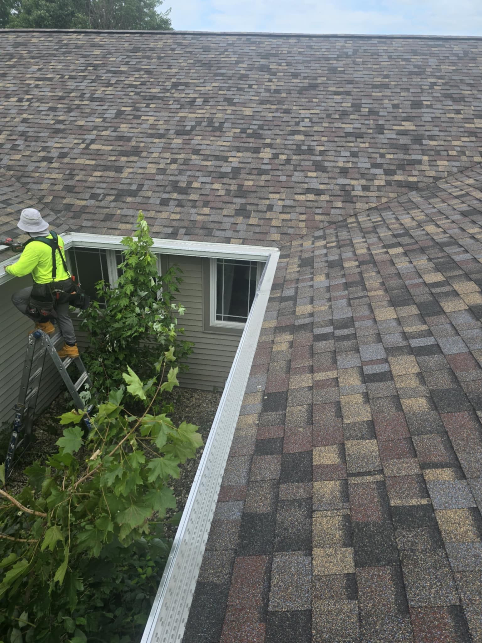 Exterior view of seamless gutters and shingle roofing services provided in Middleton WI.