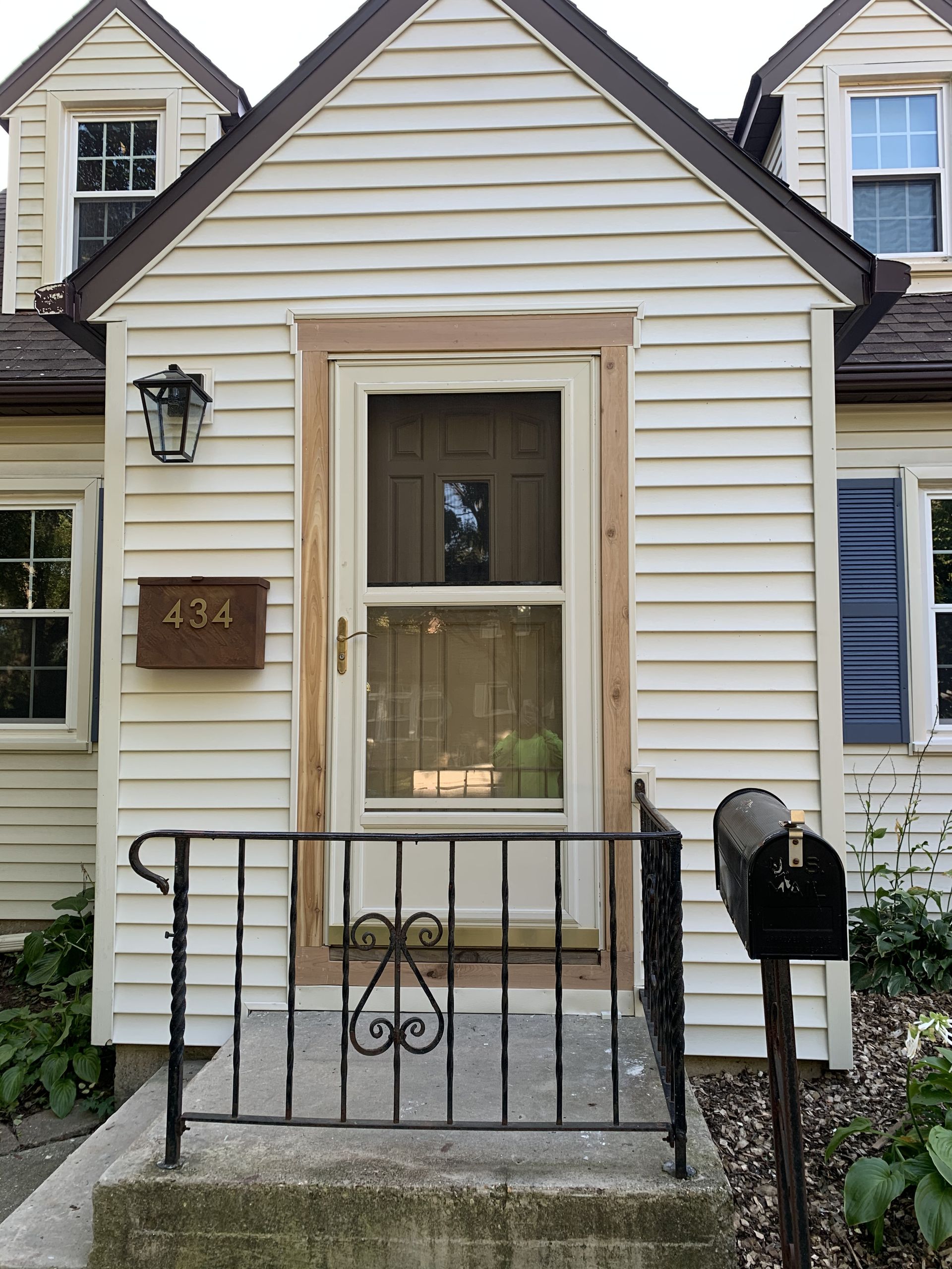 Expert siding installation featuring blue vinyl panels and protective house wrap in Middleton WI.