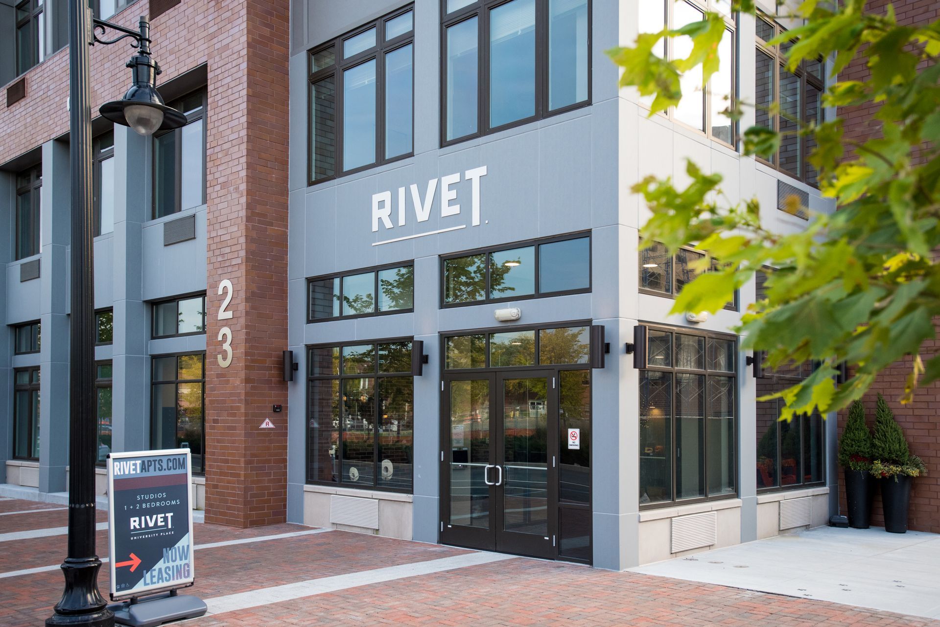 A large building with a sign in front of it that says rivet.
