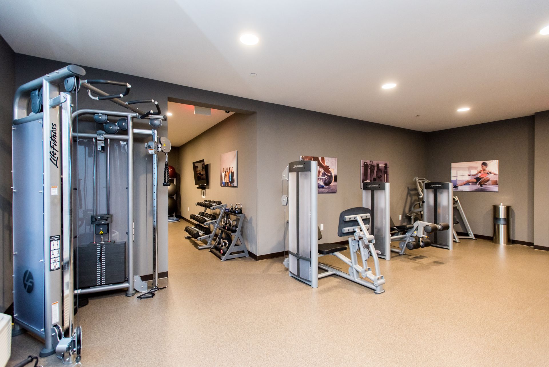 A large gym with a lot of exercise equipment