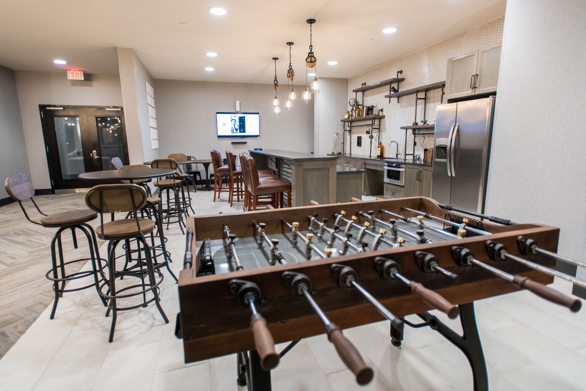 There is a foosball table in the middle of the room.