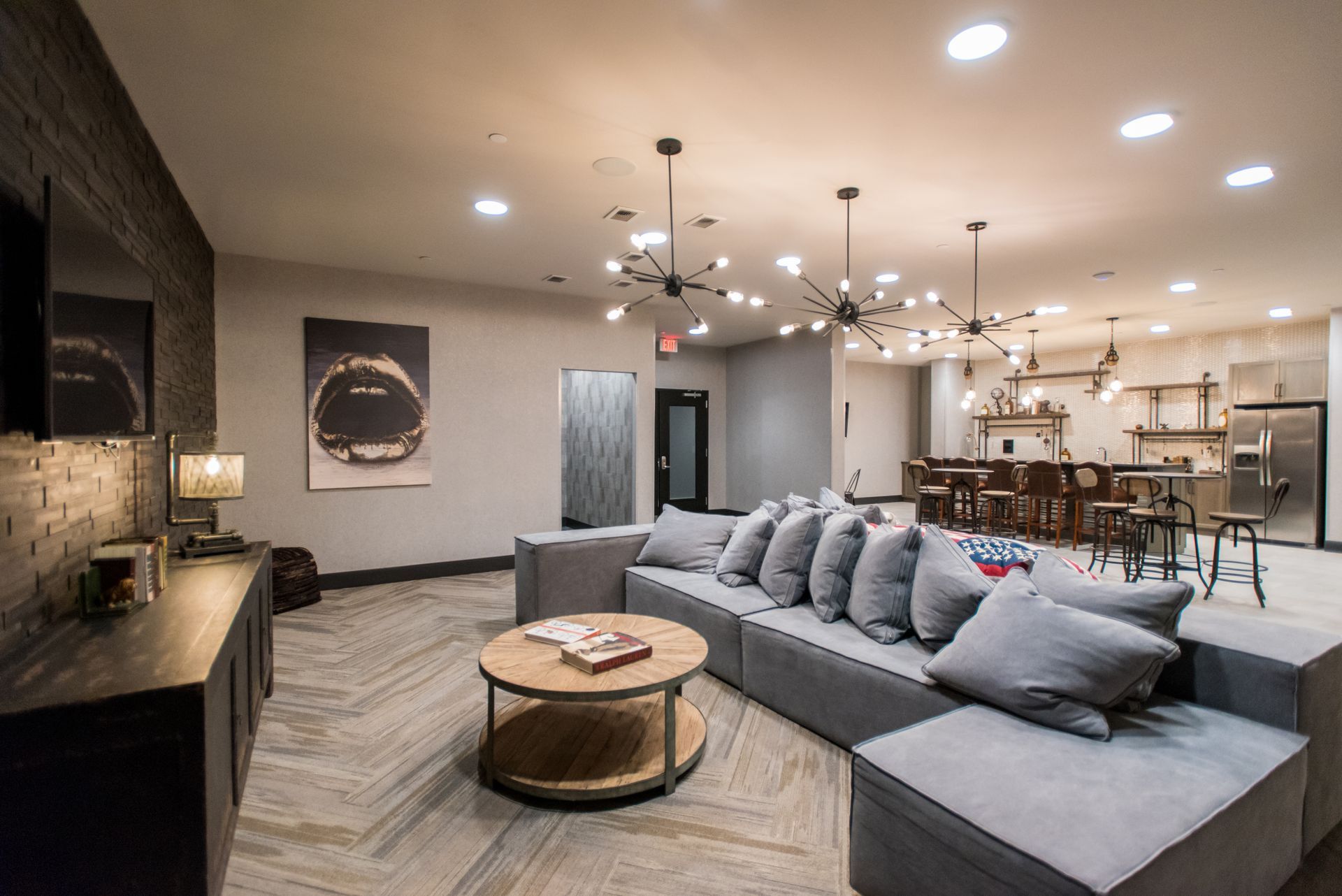 A living room with a couch , coffee table , and television.