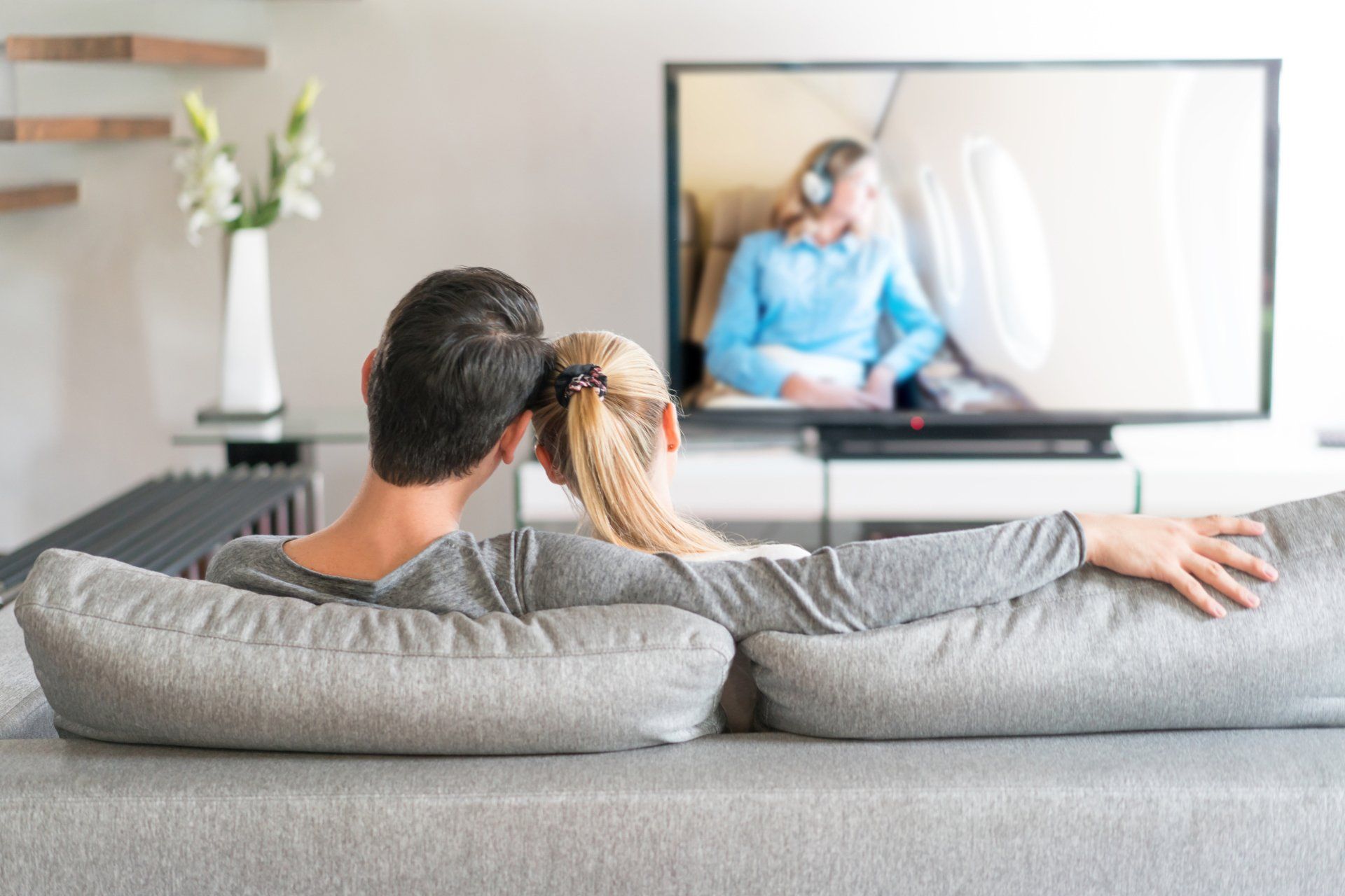 Couple watching TV from couch