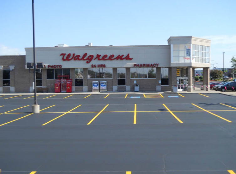 A Parking Lot in Front of a Store — Covington, LA — Jenkins Construction and Asphalt