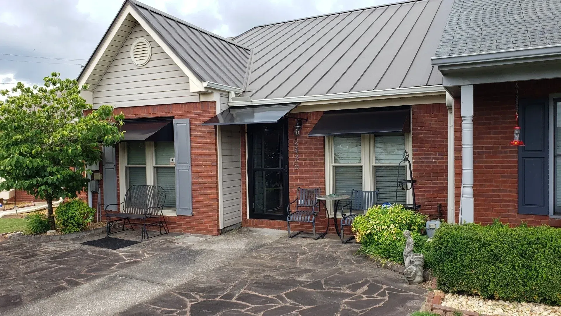 House with Gray Roof & Shutters — Decatur, AL — Evans Awnings