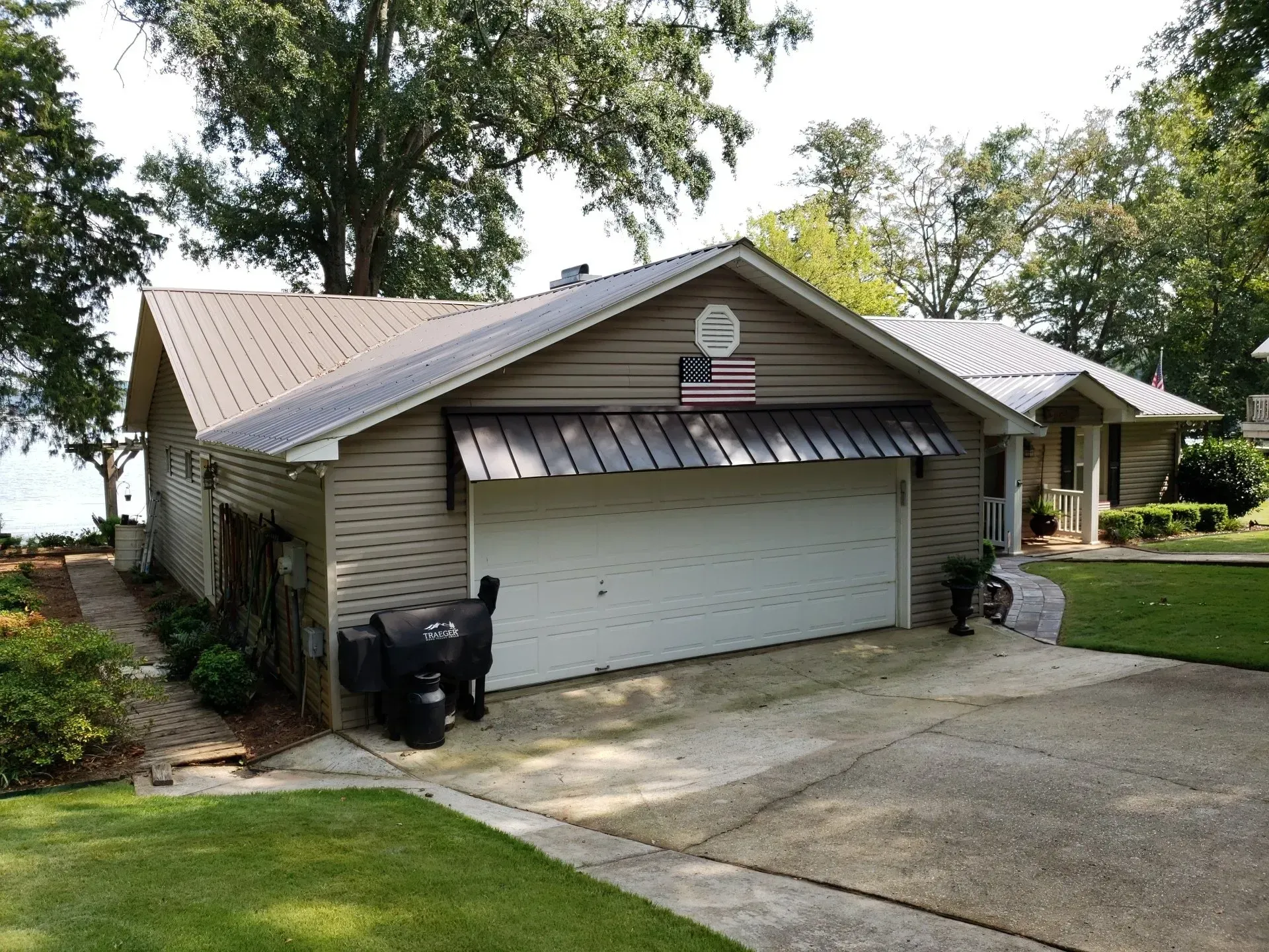 Garage with Flag on the Roof — Decatur, AL — Evans Awnings