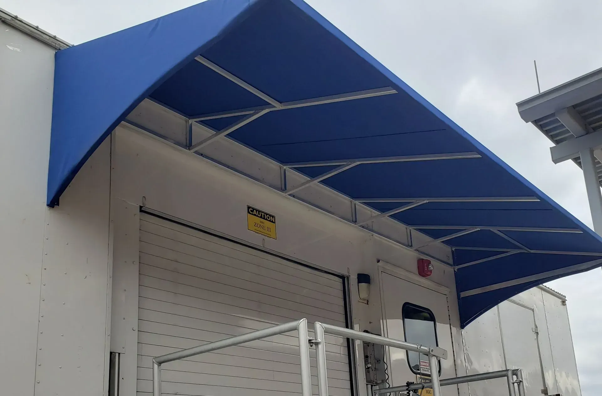 Absolute Imaging Blue Slope Awning — Decatur, AL — Evans Awnings