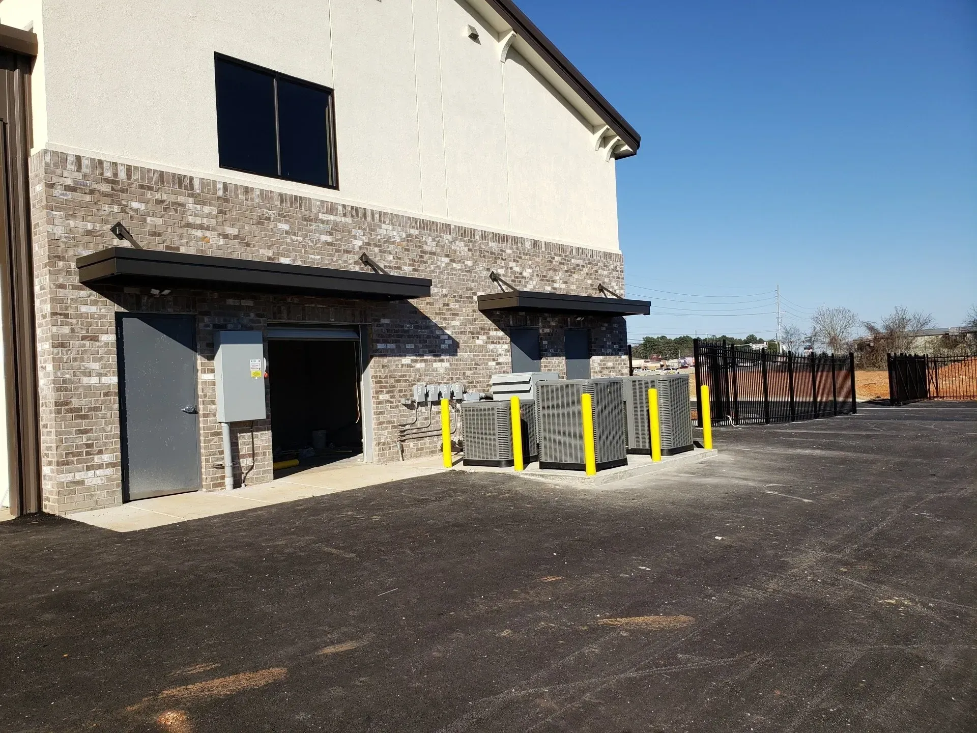 Building with Two Overhead Rod Canopy — Decatur, AL — Evans Awnings