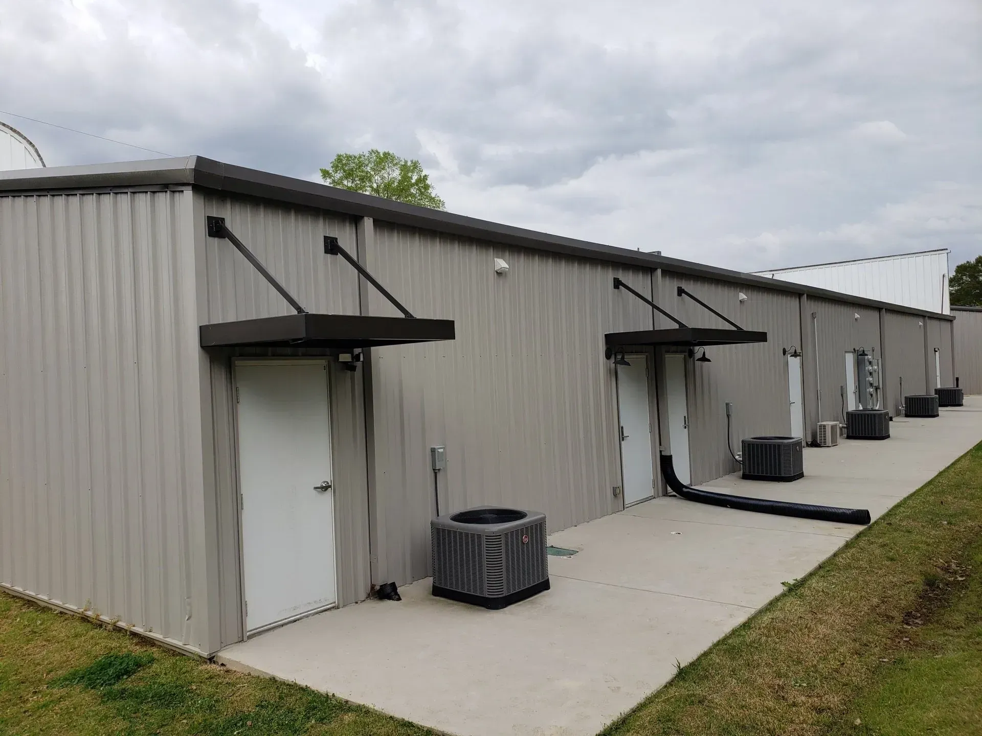 Building with Air Conditioners & Canopy — Decatur, AL — Evans Awnings