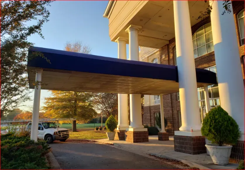 White Car Parked Under a Blue Awning — Decatur, AL — Evans Awnings