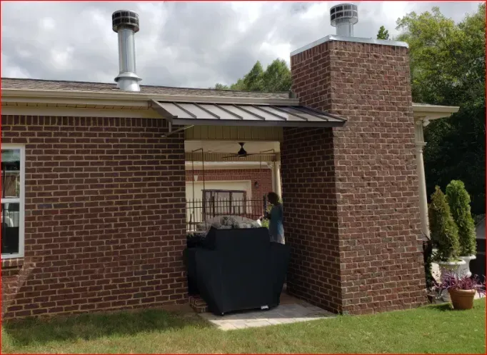 House with Chimney and Standing Seam Slope Awning — Decatur, AL — Evans Awnings