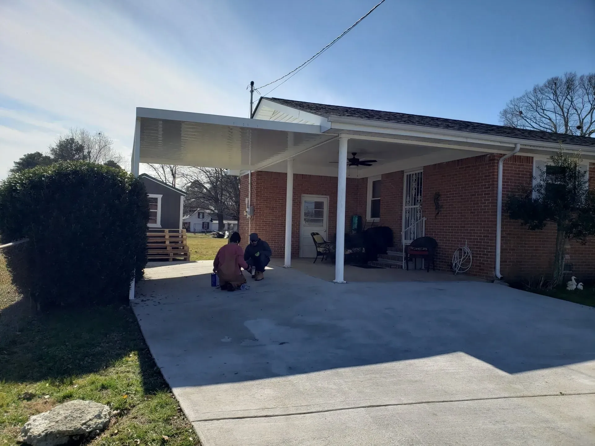 Two Men Under the Carport Cover — Decatur, AL — Evans Awnings