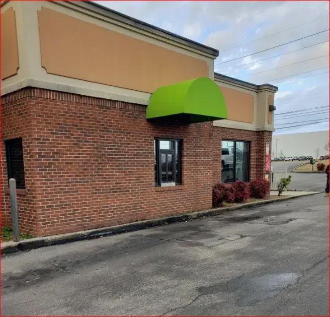 Building with Light Green Awning — Decatur, AL — Evans Awnings