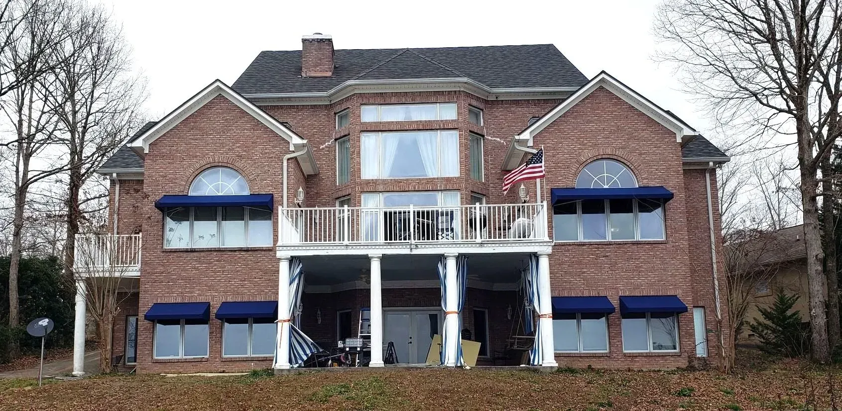 Large Brick House with Blue Awnings — Decatur, AL — Evans Awnings