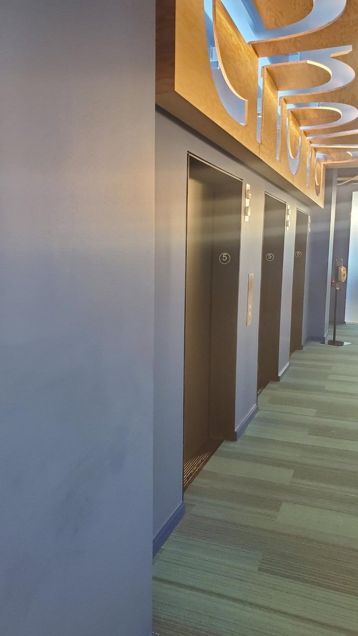 A long hallway with elevators