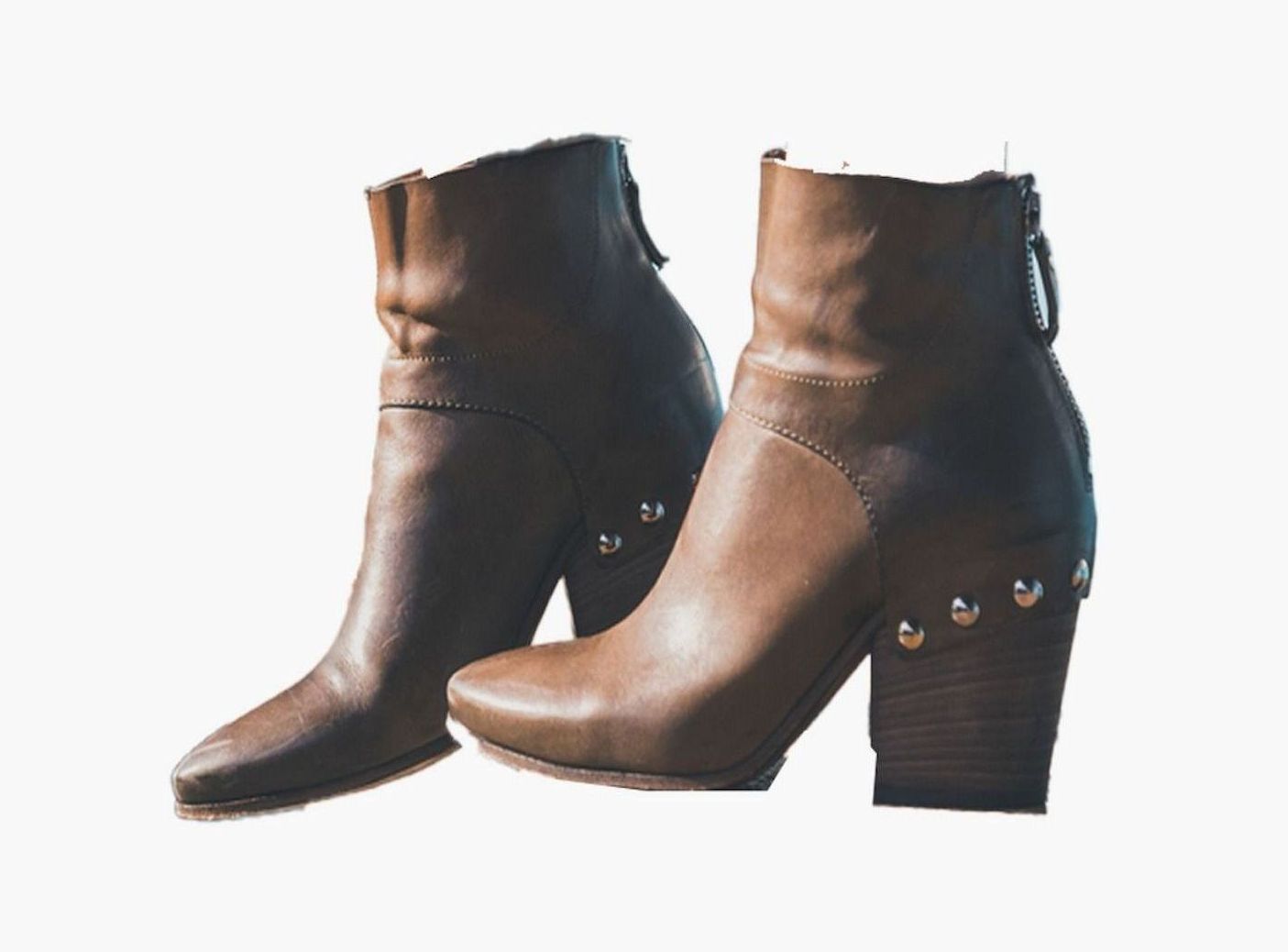 A Pair Of Brown Boots With Studs On The Heels On A White Background — Tableland Workwear In Tolga, QLD