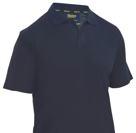 A Bunch of Different Colored Shirts Are Stacked on Top of Each Other — Tableland Workwear In Tolga, QLD