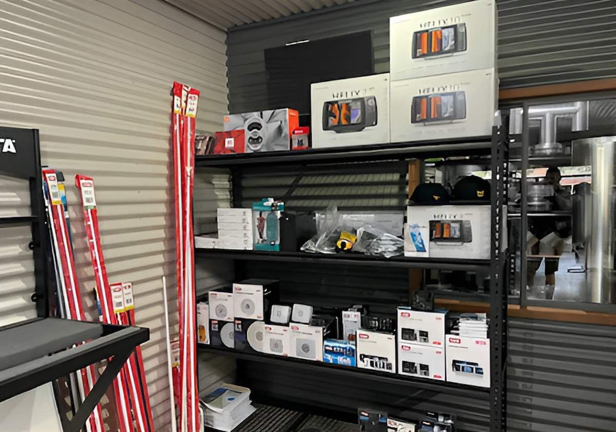 A Room With A Lot Of Shelves And Boxes On Them — Tableland Workwear In Tolga, QLD