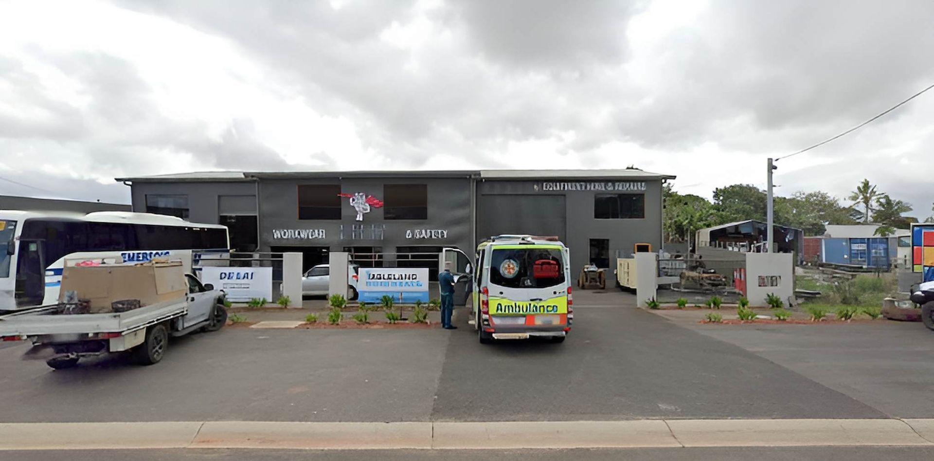 An Ambulance Is Parked In Front Of A Building — Tableland Workwear In Tolga, QLD