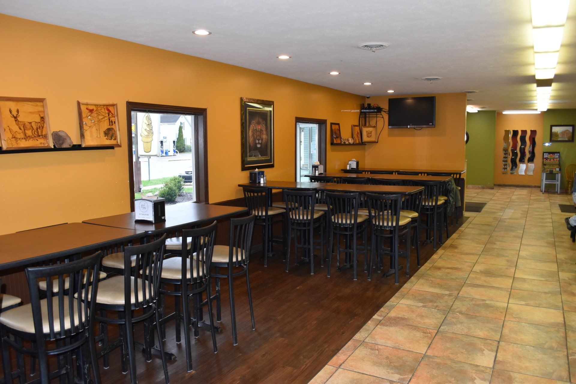 A large room with tables and chairs in it