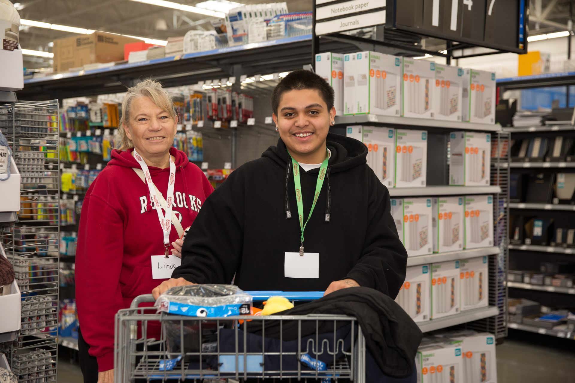 A man and a woman are standing next to each other in a store.