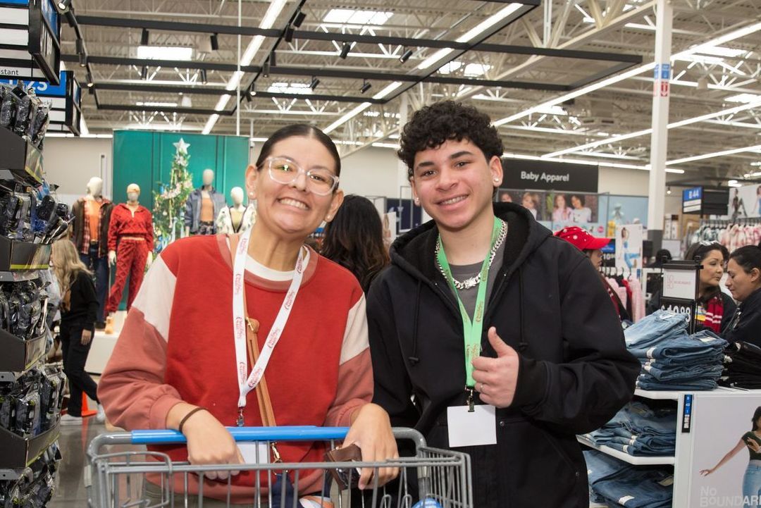 A man and a woman are standing next to each other in a store.